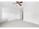 Spacious bedroom featuring neutral carpeting and two doors providing easy access to other rooms at 104 Rosebud Ln, Durham, NC 27704