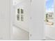 Bright bedroom with a large window offering natural light and scenic outdoor views at 104 Rosebud Ln, Durham, NC 27704