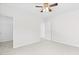 Bright bedroom with neutral carpet, and doorways to a closet and hallway at 104 Rosebud Ln, Durham, NC 27704