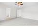 Spacious bedroom with neutral carpet and doorways to the bathroom and hallway at 104 Rosebud Ln, Durham, NC 27704