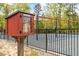 Charming community library box at the playground, offering a neighborhood book exchange at 104 Rosebud Ln, Durham, NC 27704