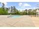 Large outdoor pool area with ample concrete, perfect for community recreation and relaxation at 104 Rosebud Ln, Durham, NC 27704