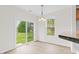 Bright dining area with sliding glass doors and a view of the backyard at 104 Rosebud Ln, Durham, NC 27704