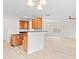 Open kitchen view, adjacent to the living room, featuring a kitchen bar at 104 Rosebud Ln, Durham, NC 27704