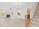 Spacious living room with fireplace, wood-look floors, and lots of natural light at 104 Rosebud Ln, Durham, NC 27704