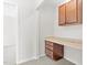 A home office with a built-in desk and cabinets in a brightly lit space at 104 Rosebud Ln, Durham, NC 27704