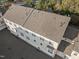 Aerial view of townhome complex showcasing roof details and well-maintained exteriors nestled amongst lush greenery at 10410 Sablewood Dr # 111, Raleigh, NC 27617