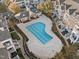 Aerial shot of a community pool and clubhouse surrounded by townhomes and manicured grounds at 10410 Sablewood Dr # 111, Raleigh, NC 27617
