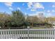 View from the balcony overlooking a beautiful green space filled with lush landscaping and trees at 10410 Sablewood Dr # 111, Raleigh, NC 27617