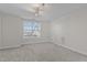 Bright and spacious carpeted bonus room with a large window at 10410 Sablewood Dr # 111, Raleigh, NC 27617