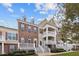 Beautiful townhome complex featuring inviting front porches and decorative columns at 10410 Sablewood Dr # 111, Raleigh, NC 27617