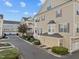Inviting townhouse complex with well-maintained landscaping, storage, and charming architectural details in a desirable neighborhood at 10410 Sablewood Dr # 111, Raleigh, NC 27617