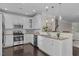 Kitchen featuring stainless steel appliances, granite countertops and white cabinets at 10410 Sablewood Dr # 111, Raleigh, NC 27617