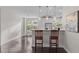 Open floorplan featuring pendant lighting, barstool seating and view of the kitchen and dining area at 10410 Sablewood Dr # 111, Raleigh, NC 27617