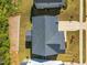 Aerial view of a home showcasing the roof, landscaping, and proximity to neighboring houses at 105 Scoville Rd, Garner, NC 27529