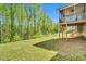 Spacious backyard with lush greenery and a screened deck perfect for outdoor enjoyment at 105 Scoville Rd, Garner, NC 27529