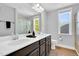 The bathroom features double sinks, white countertops, and dark wood cabinets at 105 Scoville Rd, Garner, NC 27529