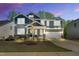 Beautiful two-story home featuring stone accents, neutral siding and a two car attached garage at 105 Scoville Rd, Garner, NC 27529
