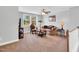 Cozy living room with neutral walls, comfortable seating, and a view of the outside at 105 Scoville Rd, Garner, NC 27529