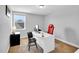 The office has neutral walls, carpet flooring, a window, and a white desk and chairs at 105 Scoville Rd, Garner, NC 27529