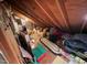 An attic providing extra storage space with its wood rafters and flooring at 106 Orchard Rd, Henderson, NC 27536