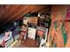 This attic space has a wood ceiling and is used for storage of boxes and household goods at 106 Orchard Rd, Henderson, NC 27536