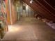 Spacious attic area ready to be finished, featuring exposed rafters and insulation at 106 Orchard Rd, Henderson, NC 27536