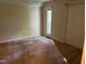 Bright bedroom with a window and closet showcasing a simple, clean design at 106 Orchard Rd, Henderson, NC 27536