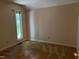Simple bedroom with a window providing natural light and a view of the outdoors at 106 Orchard Rd, Henderson, NC 27536