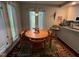 Sunlit breakfast nook with a round table and comfortable seating at 106 Orchard Rd, Henderson, NC 27536