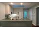 Bright kitchen with stainless steel appliances, tile countertops, and a skylight providing natural light at 106 Orchard Rd, Henderson, NC 27536