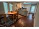 Eat-in kitchen features a sunny breakfast nook and white cabinetry at 106 Orchard Rd, Henderson, NC 27536