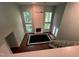 Elegant living room with a fireplace and floor-to-ceiling windows at 106 Orchard Rd, Henderson, NC 27536