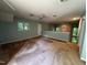 Cozy living room with a ceiling fan and lots of natural light, creating an inviting space at 106 Orchard Rd, Henderson, NC 27536