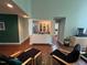 Living room with open pass-through to the kitchen and access to the dining area at 106 Orchard Rd, Henderson, NC 27536
