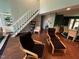 Living room featuring a staircase, lounge seating, and access to the dining area at 106 Orchard Rd, Henderson, NC 27536