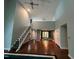 Spacious living room with a staircase to the second floor and an adjacent dining area at 106 Orchard Rd, Henderson, NC 27536