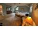 Inviting main bedroom featuring a sitting area, ceiling fan, and large window at 106 Orchard Rd, Henderson, NC 27536