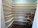 Walk-in pantry with multiple shelves and storage space at 106 Orchard Rd, Henderson, NC 27536