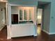 Home wet bar, providing a sink, storage and view into another room at 106 Orchard Rd, Henderson, NC 27536