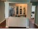 Open wet bar features a sink, display cabinet, and Art Deco poster at 106 Orchard Rd, Henderson, NC 27536