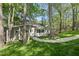 Lush backyard with trees and landscaped flower bed at 108 Ridgepath Way, Cary, NC 27511