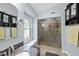 Modern bathroom with granite counters, frameless glass shower, natural light, and sleek fixtures at 108 Ridgepath Way, Cary, NC 27511