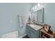A well-lit bathroom with a vanity, mirror, and storage space at 108 Ridgepath Way, Cary, NC 27511