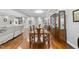 Open-concept dining area adjacent to the living room, with hardwood floors and lots of space at 108 Ridgepath Way, Cary, NC 27511