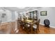 Formal dining room featuring hardwood floors, a glass table, and stylish decor at 108 Ridgepath Way, Cary, NC 27511