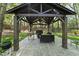 Covered outdoor gazebo with seating and grill at 108 Ridgepath Way, Cary, NC 27511