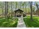 Outdoor gazebo featuring seating, a grill, and a stone pathway at 108 Ridgepath Way, Cary, NC 27511
