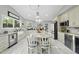 Spacious kitchen features granite counters, a large island with seating, and stainless steel appliances at 108 Ridgepath Way, Cary, NC 27511