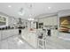 Bright kitchen boasts granite counters, a central island, and marble backsplash at 108 Ridgepath Way, Cary, NC 27511